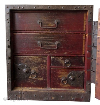 Antique Japanese Keyaki Fune Bako

Antique Japanese solid Keyaki (zelkova) hardwood fune bako or ship safe box. The front of the box has heavy iron plating with the number one (ichi) within a  ...