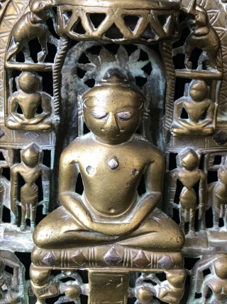 17th Century Silver Inlaid Brass Jain Shrine

Ancient Indian Jain religious shrine, the central Jina surrounded by multiple celestial nymphs with two elephants at the top on either side of the parasol. This  ...