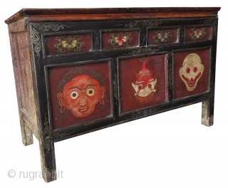 Rare 18th Century Tibetan Buddhist Painted Altar Cabinet

Rare Tibetan hand-painted lacquer altar cabinet. Original finish with patina. The front three panels depict three faces. The left face has red skin and green  ...