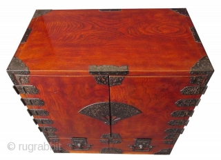 Rare Antique Japanese Solid Keyaki Burl Fan Lock Tansu

A rare and unusual Japanese Keyaki burl choba tansu with original dark red translucent lacquer finish. The front of the chest has two hinged  ...