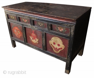 Rare 18th Century Tibetan Buddhist Painted Altar Cabinet

Rare Tibetan hand-painted lacquer altar cabinet. Original finish with patina. The front three panels depict three faces. The left face has red skin and green  ...