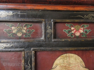 Rare 18th Century Tibetan Buddhist Painted Altar Cabinet

Rare Tibetan hand-painted lacquer altar cabinet. Original finish with patina. The front three panels depict three faces. The left face has red skin and green  ...