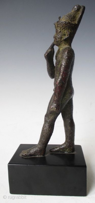 Rare Antique Egyptian Bronze Walking Nobleman

Rare Antique bronze figure of a nude nobleman in walking pose, his pointer finger of his right hand resting up against his chin, with green patina and  ...