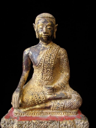 Antique Thai Seated Gilt Bronze Buddha

Gilt bronze Buddha seated with serene expression. Intricate metal granulation on drapery and throne. Details of red lacquer on tiered trapezoidal seat. Thailand. 

Early 19th century 

Dimensions:  ...