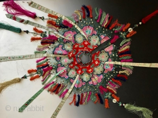Chinese Embroidered Cloud Collar

A delicate antique Chinese child's collar with stitch work. The fine knitting on the edge is embellished with small white metal discs and multicolored tassels. The shawl collar is  ...