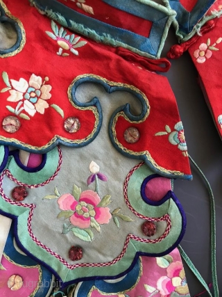 Chinese Embroidered Cloud Collar

A delicate antique Chinese child's collar with stitch work. The fine knitting on the edge is embellished with small white metal discs and multicolored tassels. The shawl collar is  ...