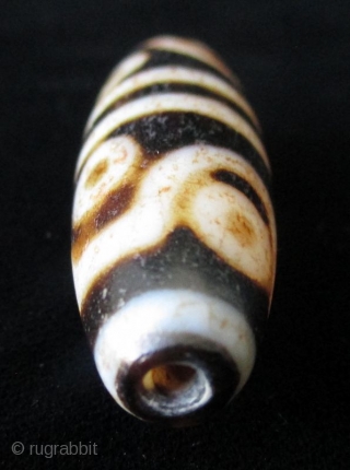 Antique Tibetan 8 Eye Dzi Bead

Antique Tibetan Dzi bead, agate with 8 eyes. The mystical Dzi beads are implements of ancient Tibetan and other Asian cultures for several hundreds of thousands of  ...