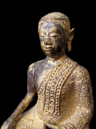 Antique Thai Seated Gilt Bronze Buddha

Gilt bronze Buddha seated with serene expression. Intricate metal granulation on drapery and throne. Details of red lacquer on tiered trapezoidal seat. Thailand. 

Early 19th century 

Dimensions:  ...