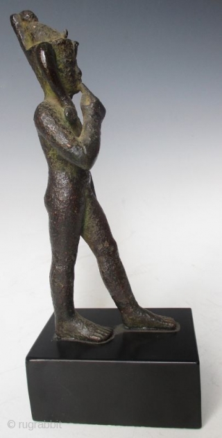 Rare Antique Egyptian Bronze Walking Nobleman

Rare Antique bronze figure of a nude nobleman in walking pose, his pointer finger of his right hand resting up against his chin, with green patina and  ...