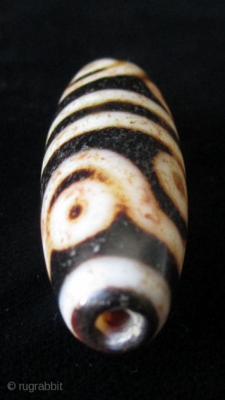 Antique Tibetan 8 Eye Dzi Bead

Antique Tibetan Dzi bead, agate with 8 eyes. The mystical Dzi beads are implements of ancient Tibetan and other Asian cultures for several hundreds of thousands of  ...