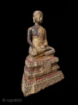 Antique Thai Seated Gilt Bronze Buddha

Gilt bronze Buddha seated with serene expression. Intricate metal granulation on drapery and throne. Details of red lacquer on tiered trapezoidal seat. Thailand. 

Early 19th century 

Dimensions:  ...