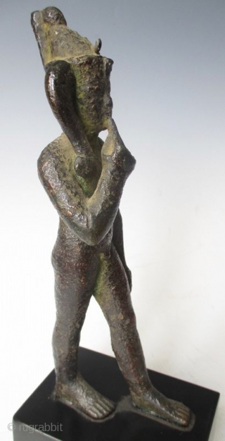 Rare Antique Egyptian Bronze Walking Nobleman

Rare Antique bronze figure of a nude nobleman in walking pose, his pointer finger of his right hand resting up against his chin, with green patina and  ...