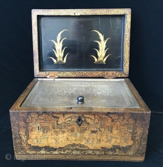 18th Century Antique Chinese Lacquered Tea Box

A delicate antique Chinese Tea Box with exquisitely decorated gilt relief. It has a pewter box lining with a glass knob. The lacquer shows images of  ...