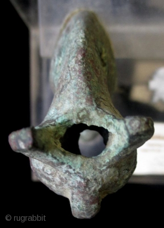 Antique Pair of Egyptian Bronze Cats

Egyptian bronze pair of cat figures with overall wear and green patina. Pierced holds through the mouths, heads, necks, and bases suggest they may have once been  ...