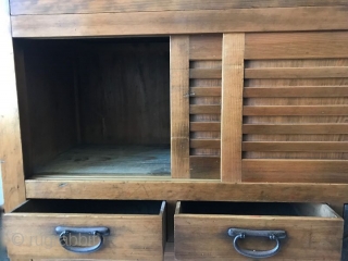 Antique Japanese Choba Tansu
An antique Japanese Choba (merchant) Tansu of hinoki wood and iron hardware. The top section has one large drawer with two handles. The middle section has two sliding doors  ...