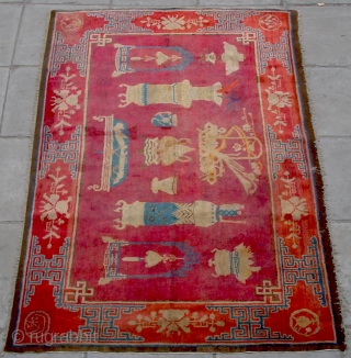 No.R022 * Chinese Antique "Vase Design" Rug,Age:19th Century.Size: 136x219cm(4'6"x7'2").Origin: Baotou-Suiyuan.Shape: Rectangle.Background Color: Reds.
This interesting carpet depicts the symbols of Hundred of Antiques: the incense burner, the teacup, the Ruyi (meaning wish come  ...