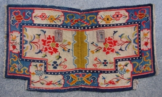 No.R130 * Antique Tibet Saddle Rug. Age:19th Century. Size: 64 x 113cm (2'1"x3'8"). Origin:Tibet. Background Color:Off-whites,lvory.Flower design on an intricate linking "Eight Buddhist Symbols" border.        