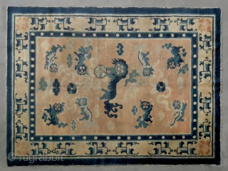 No.CL001 * Chinese Antique "Nine Fo-dogs" Ningxia Rug.Size: 135 x 180cm (4'5"x5'11").Age: 18th Century. Origin: Ningxia.Background Color: The Wood Reds .Shape: Rectangle. In the centre field a sitting fo-dog is surrounded by  ...
