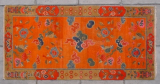 No.R107 * Tibetan Antique "Clouds and The Three Fruits " Rug. Early-20th Century. Size: 90x180cm ( 2'11" x 5'11" ).Origin: Tibetan.Shape: Rectangle. Background Color: Oranges. cotton/wool.
This ecclesiastical rug boasts an orange colored  ...