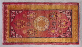 No.D001 * Chinese Khotan Antique Rug .Origin: Xinjiang-Khotan. Shape: Rectangle.Age: 19th/20th Century.Size:76x137cm(2'6"x4'8").Background Color:Reds,
It features a single central medallion which appears to be the stylized combination of a pomegranate (the symbol of male  ...