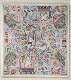 Embroidered cushion. A noble hunter is portrayed on horseback, with a falcon on his arm. The smaller-scale human figure on the haunches of his steed, however, would suggest he is connected to St George, the protector of Hellenism. From Lefkada, Ionian Islands, 17th-18th c. Gift of Panayiotis Lidorikis (ΓΕ 6268) Image and text copyright Benaki Museum
